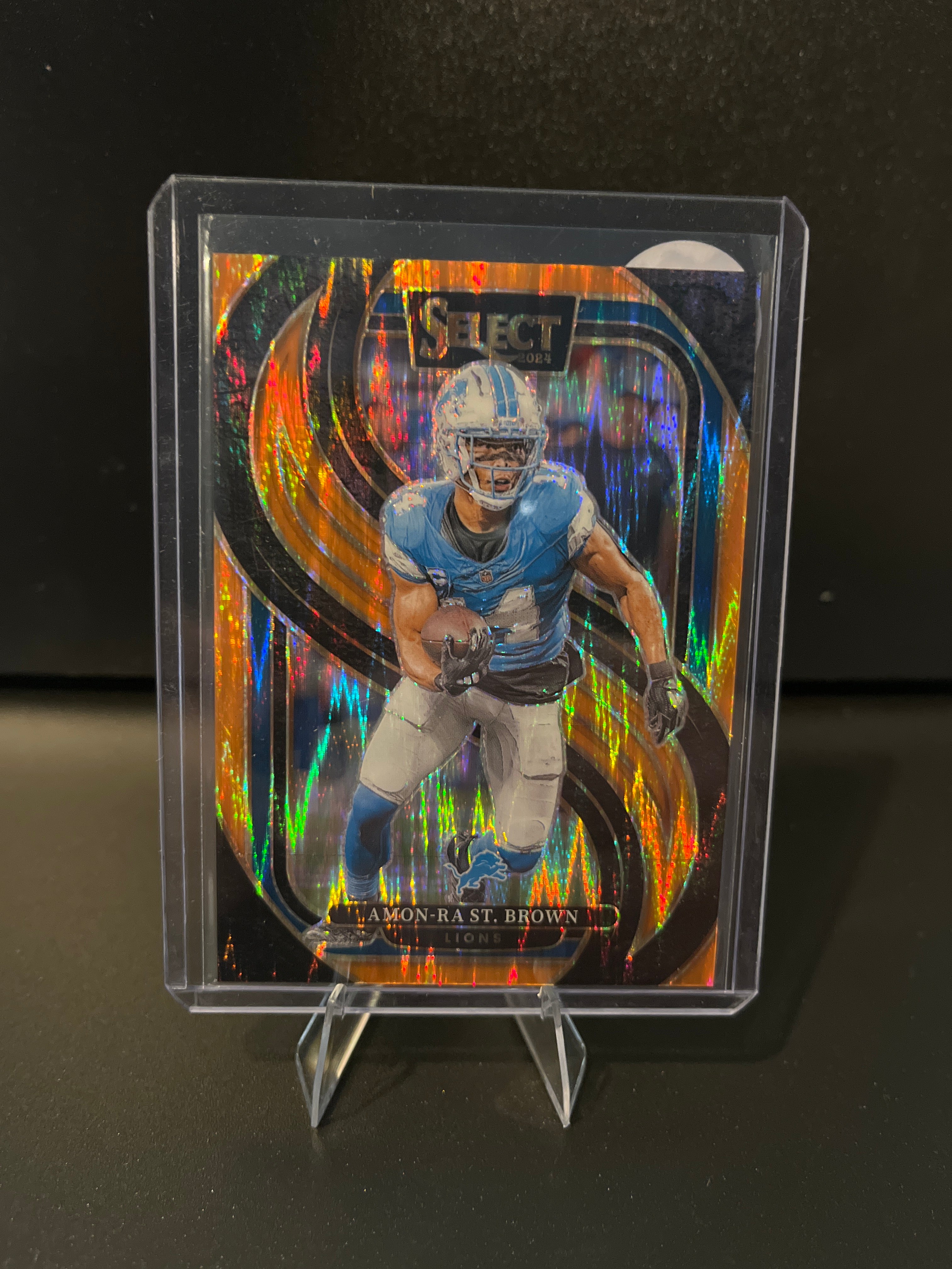 2024 Select Football Amon-Ra St. Brown Orange Prizm Shock No. 105 224/399